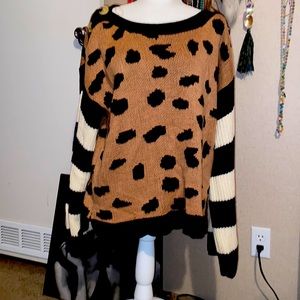 Large leopard and striped sweater with button accent on shoulders